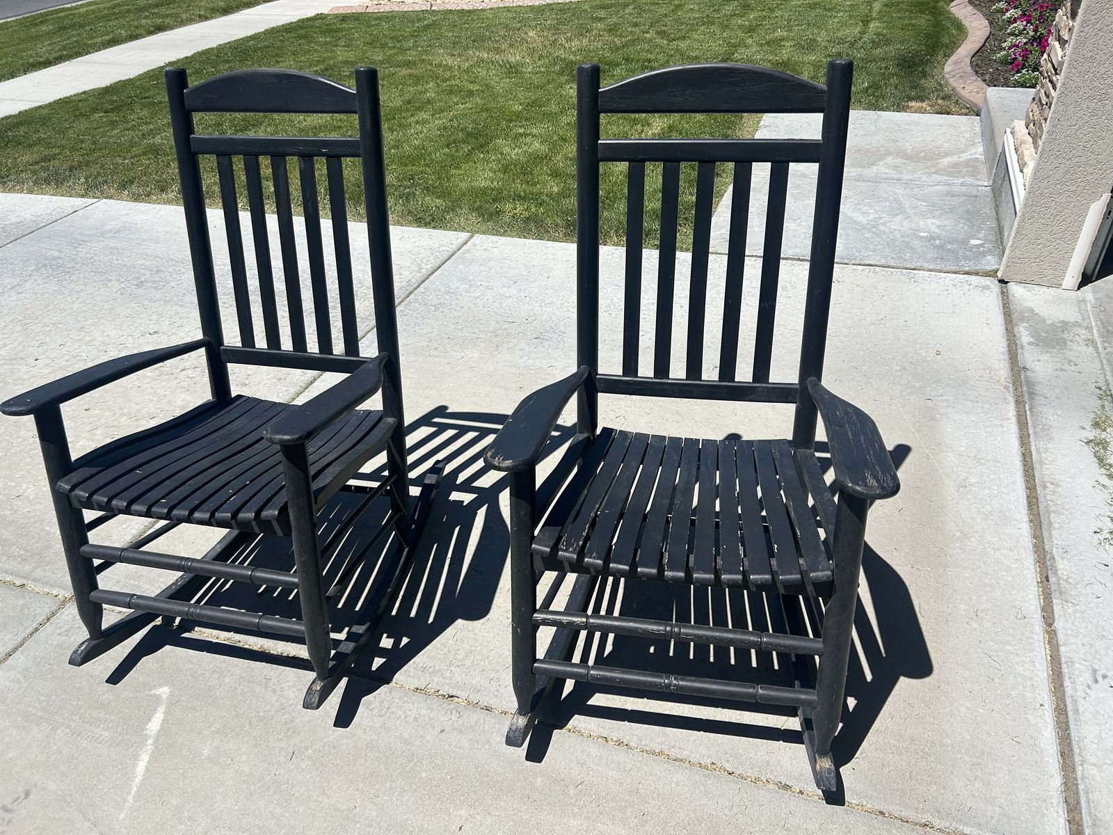 Pair of Black Wooden Rocking Chairs - Classic Slat Back Design