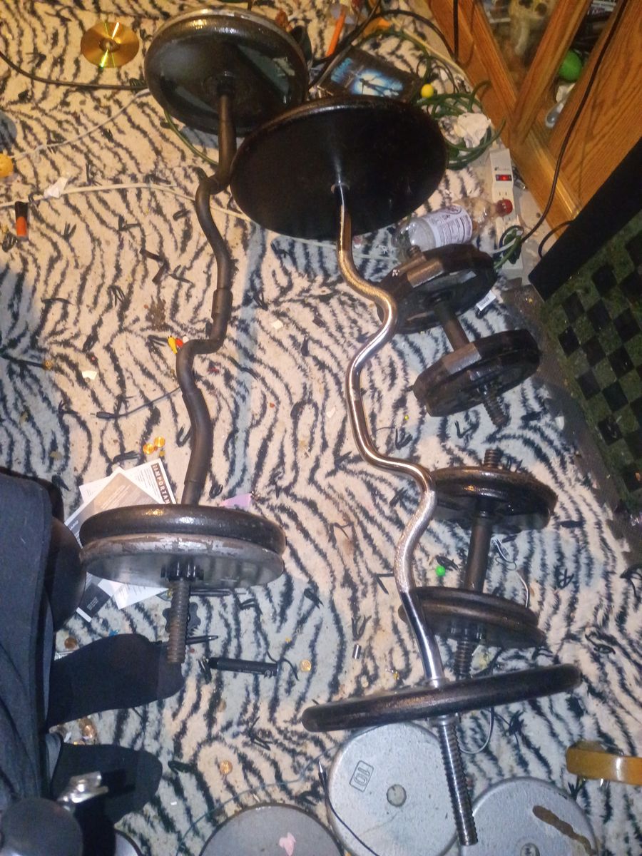 300 pounds metal plates, 2 nice curl bars , 2 dumbells, 1- 45 pound Olympic barbel