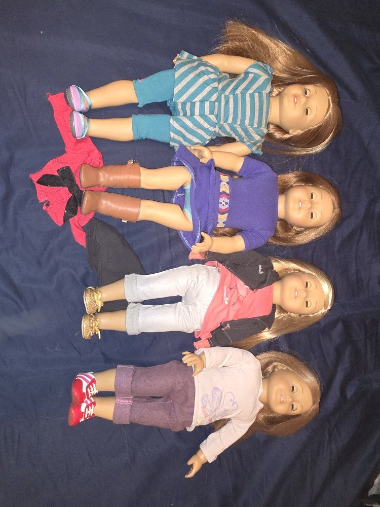 American girl doll lot of 4 dolls and extra outfit