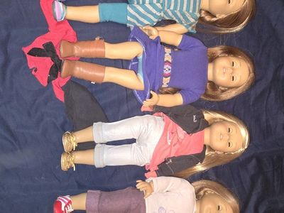 American girl doll lot of 4 dolls and extra outfit