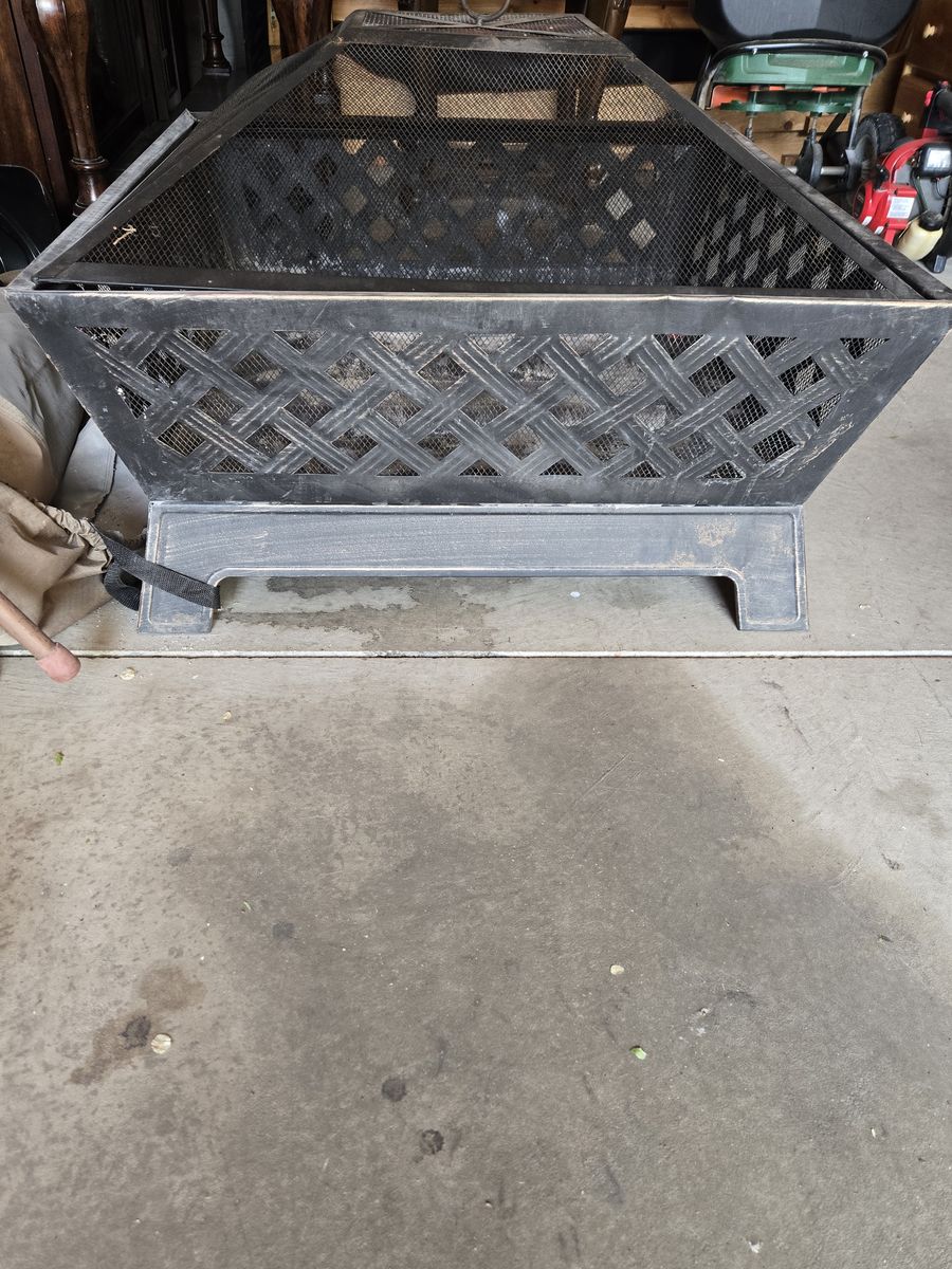 Outdoor Fire Pit Bronze with lid and cover as well.