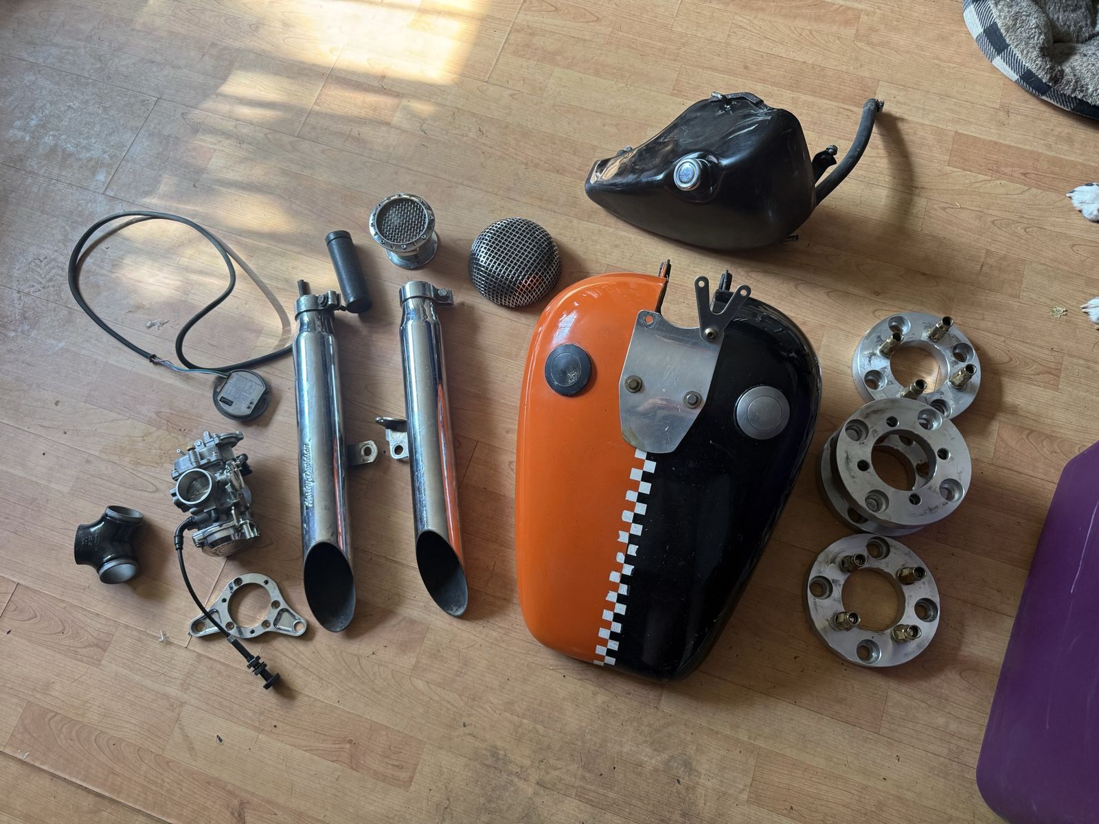 assorted box of Harley-Davidson motorcycle parts