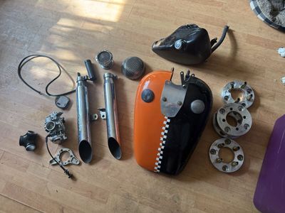 assorted box of Harley-Davidson motorcycle parts
