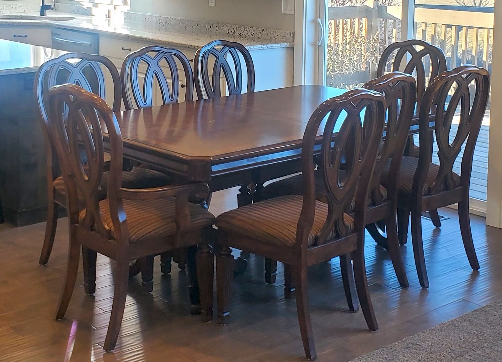 Beautiful, sturdy table with leaf and 8 chairs
