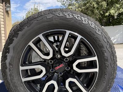 275/60 R20 tires mounted in 20” GMC wheels