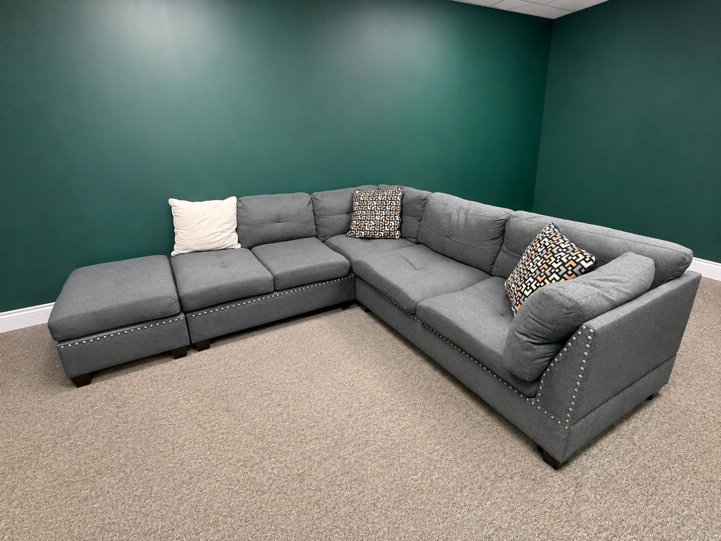 Gray Fabric L-Shaped Sectional Sofa with Nailhead Trim and Ottoman