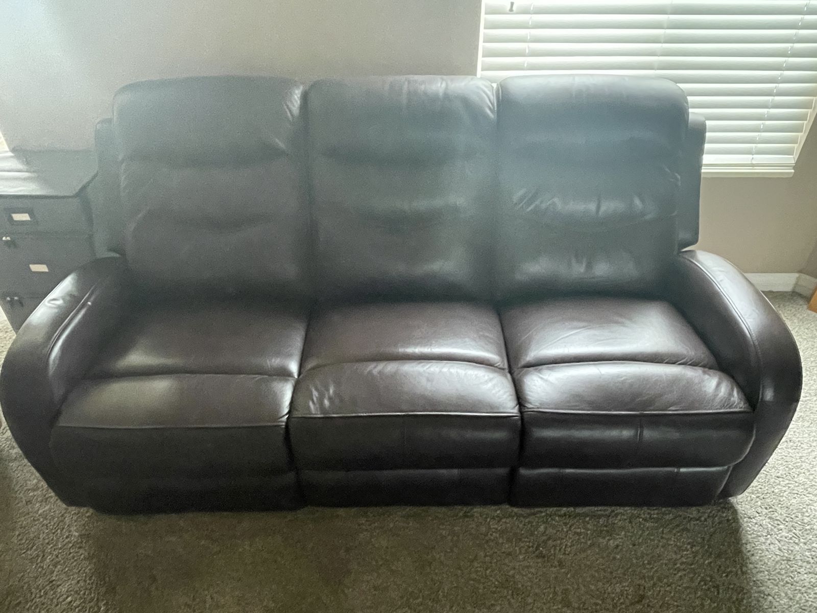 Leather recliner (2) couch.    3 seats two of which recline.