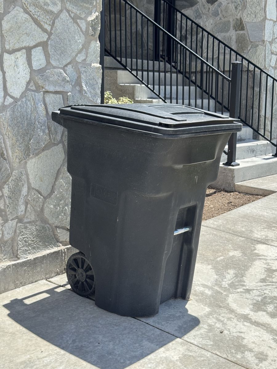Toter 96-Gallon Black Outdoor Wheeled Trash Can with Attached Lid
