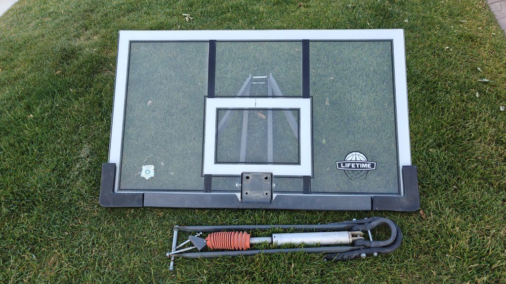 54" used Lifetime adjustable shatterproof backboard