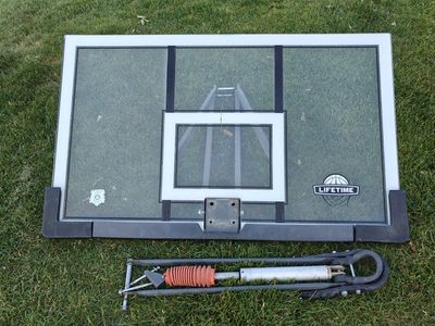 54" used Lifetime adjustable shatterproof backboard