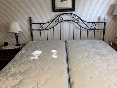Wrought Iron Headboard with XL Twin (split king) Mattresses and adjustable bed frame.