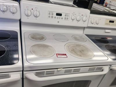 LOW PRICE GUARANTEED! GE WHITE GLASS TOP RANGE