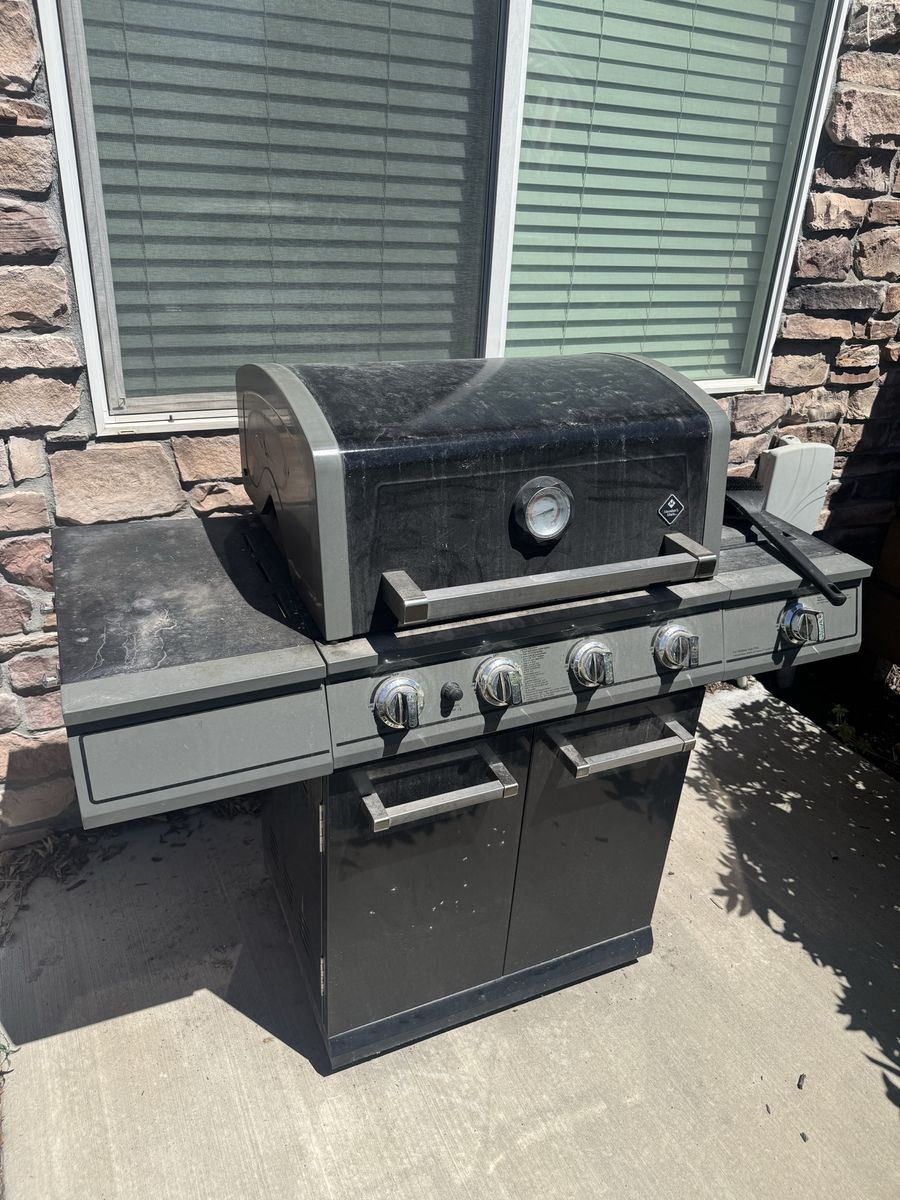 Member's Mark 4-Burner Gas Grill with Side Burner and Cabinet Storage
