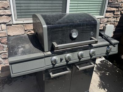 Member's Mark 4-Burner Gas Grill with Side Burner and Cabinet Storage