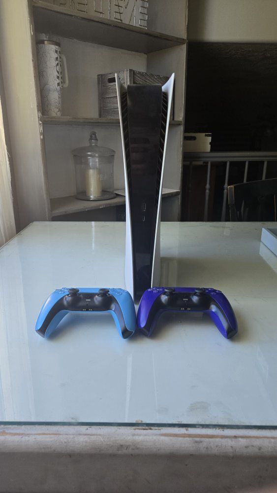 PS5 and 2 Controllers
