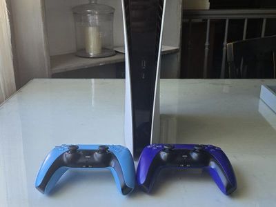 PS5 and 2 Controllers