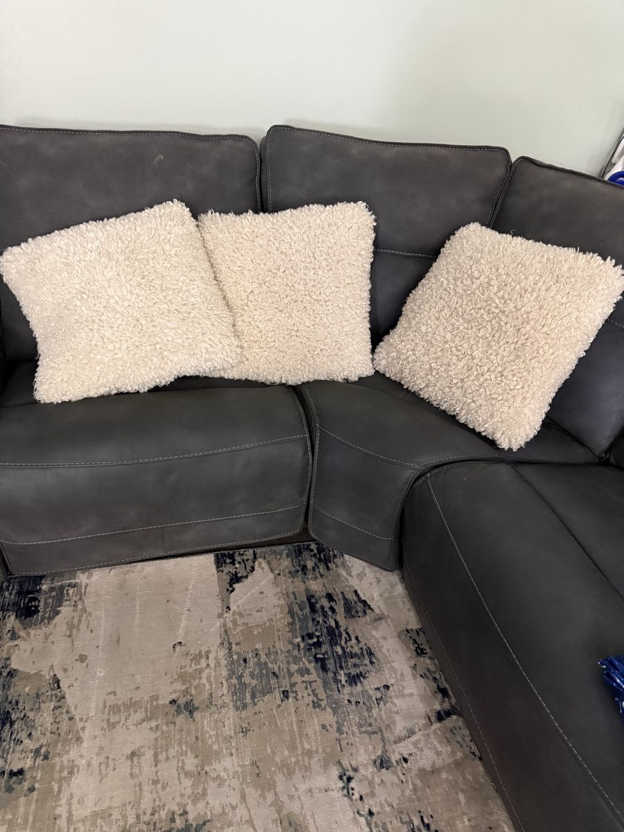 Three white throw pillows I think they’re 12“ x 12“