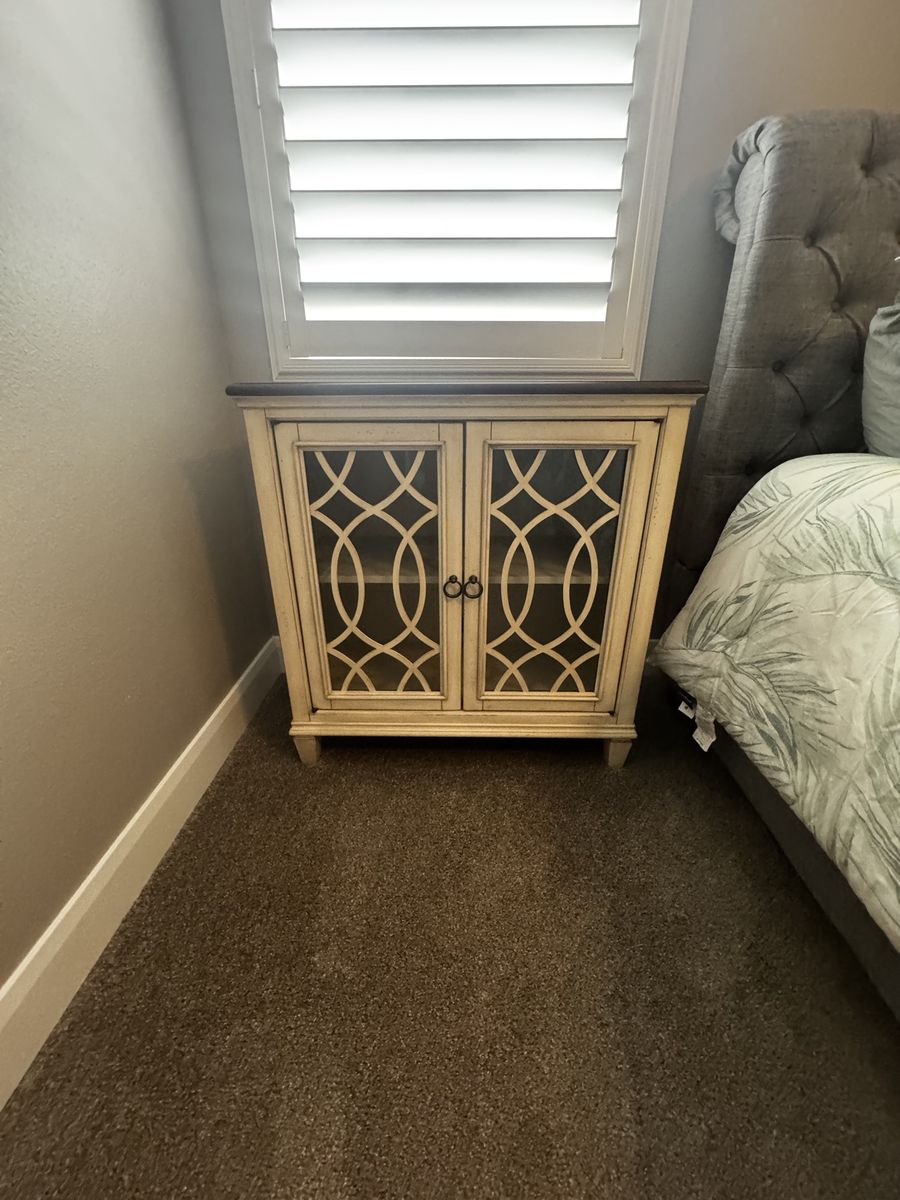 Distressed White Accent Cabinet with Glass Doors and Dark Wood Top