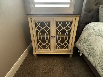 Distressed White Accent Cabinet with Glass Doors and Dark Wood Top