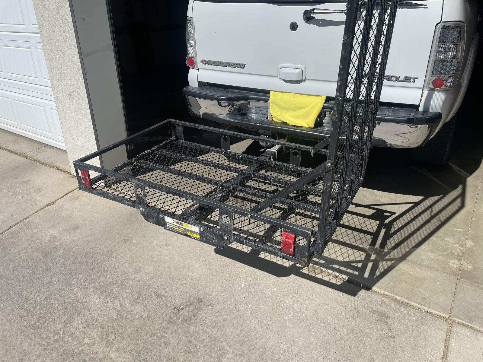 Hitch mounted wheelchair or scooter cargo carrier with ramp