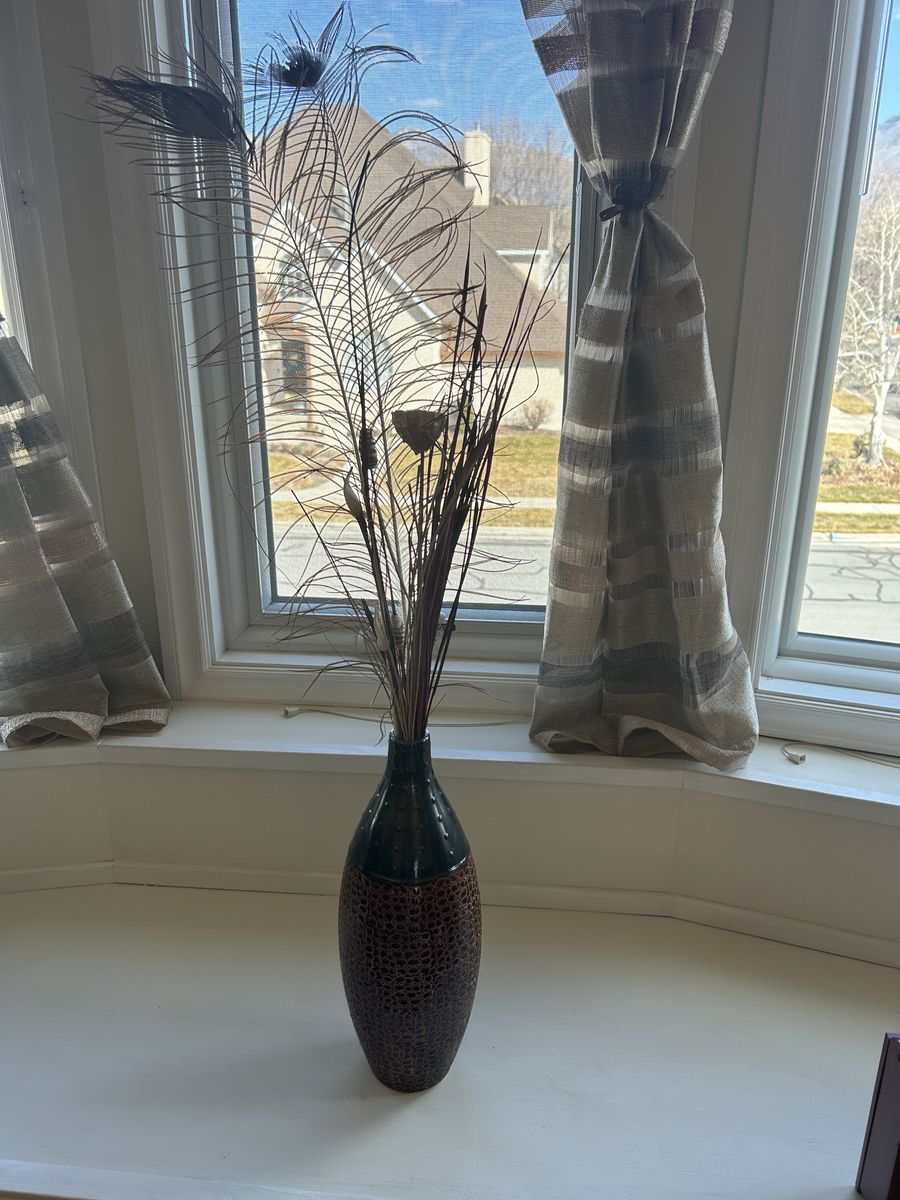Decorative Textured Vase with Peacock Feather Arrangement
