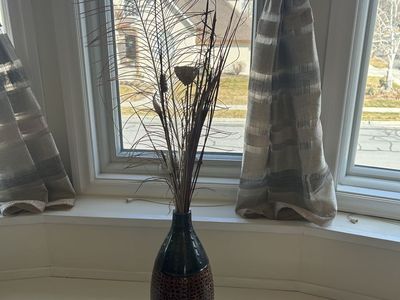 Decorative Textured Vase with Peacock Feather Arrangement