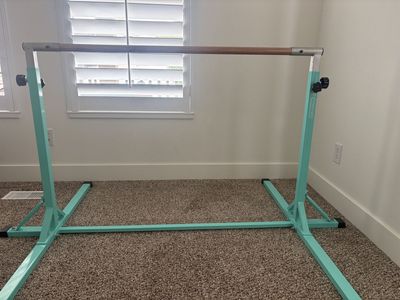 Adjustable gymnastics bar