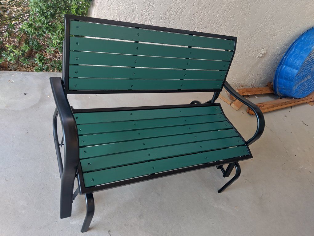Outdoor Metal and Green Slatted Patio Glider Bench