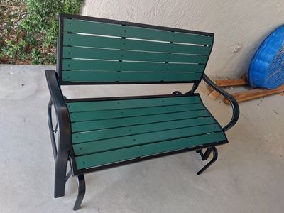 Outdoor Metal and Green Slatted Patio Glider Bench