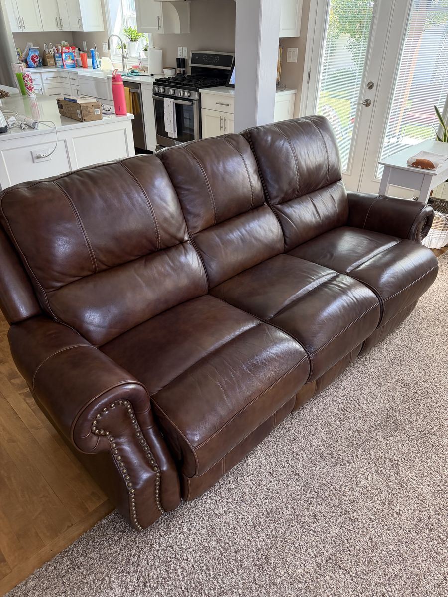 Brown leather reclining couches