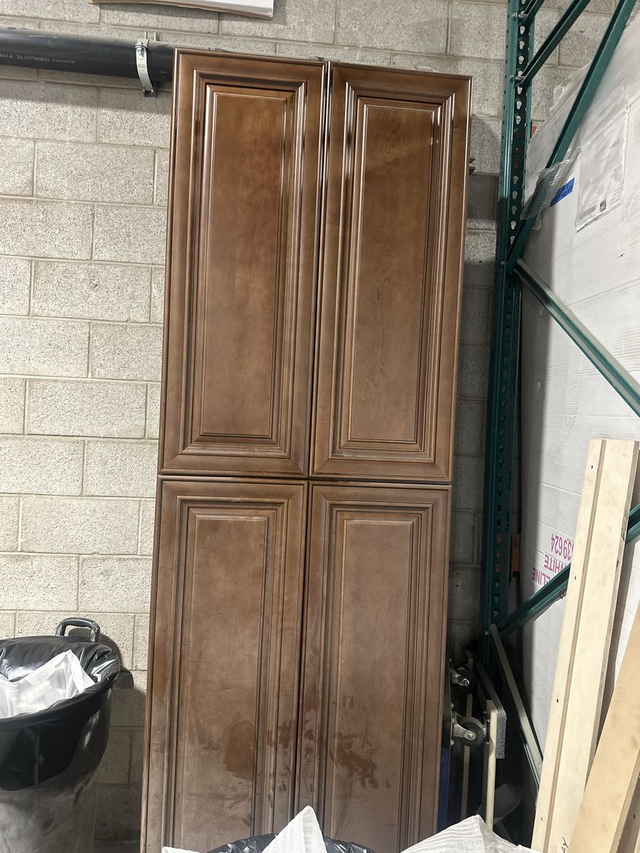 Tall Brown Wood Kitchen Pantry Cabinet with Four Doors and Shelves