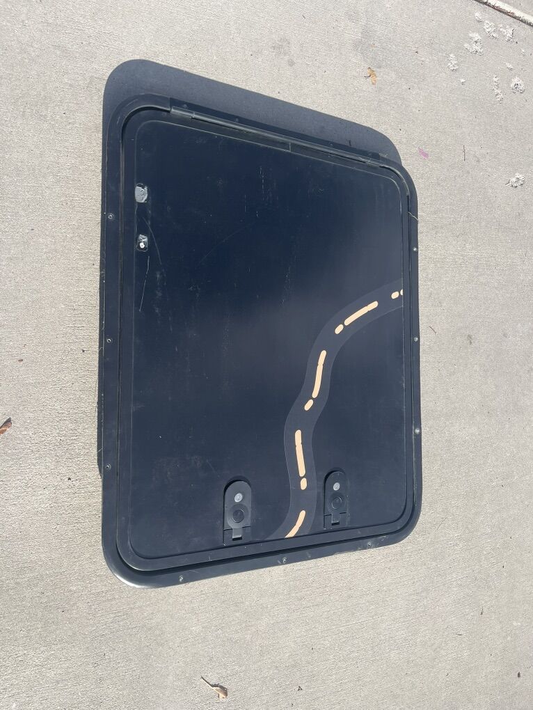 Camp trailer compartment door