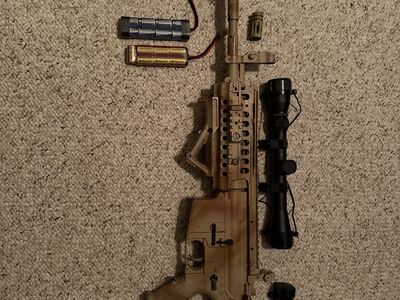 Airsoft Rifle with Scope, Red Dot sight, 2 batteries, magazine. BB’s