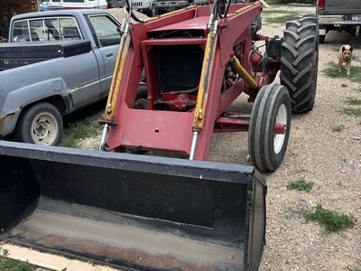IH gas Tractor with Front Loader and Bucket - Farm Equipment