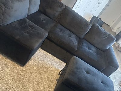Black Sectional Couch with Ottoman and Built-in USB/Power Outlets - Good Condition, also has a pull out sleeper