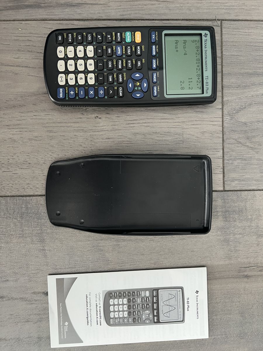 Texas Instruments TI-83 Plus Graphing Calculator with Cover and Manual
