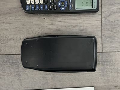 Texas Instruments TI-83 Plus Graphing Calculator with Cover and Manual