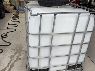 Large IBC Tote Water Tank - 275 Gallon Capacity with Metal Cage and Pallet Base