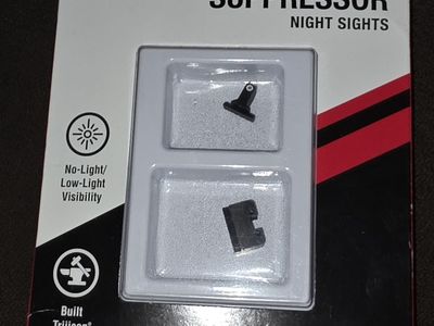 TrijiconR Suppressor/Optic Height Sights are three-dot tritium iron sights