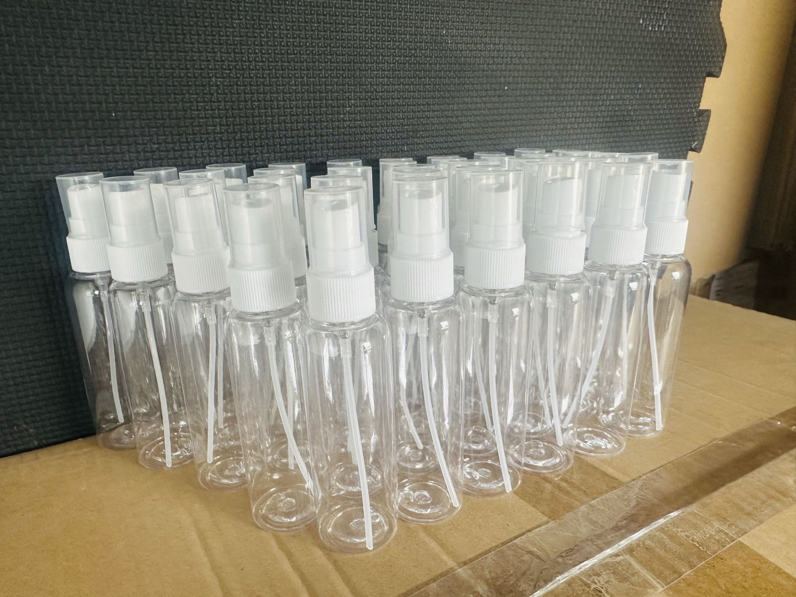 2.029 oz PET Clear Plastic Spray Bottles with Fine Mist Sprayers - 1132 Units, Bulk Empty Refillable Containers