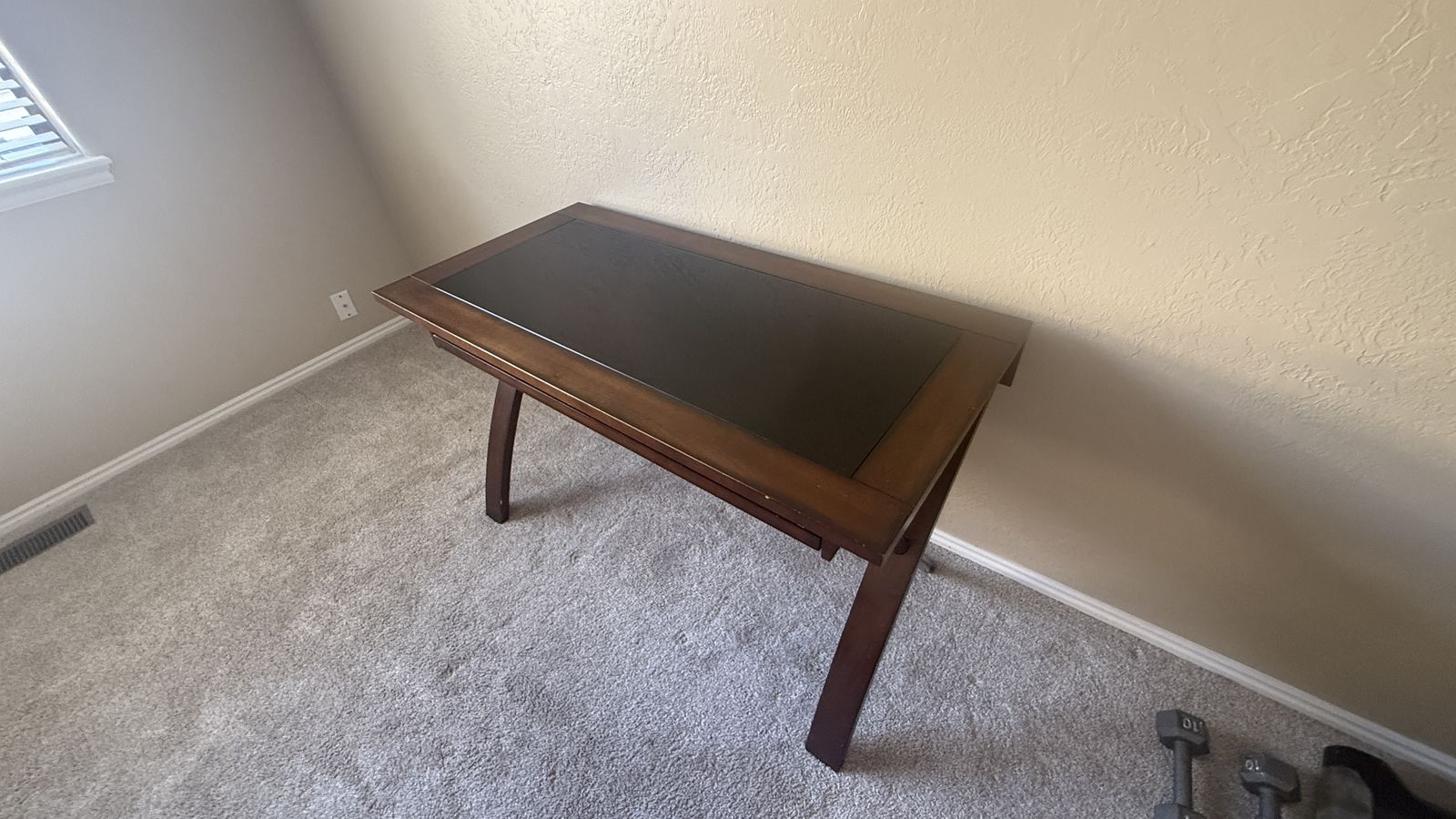 Hardwood desk with black glass top