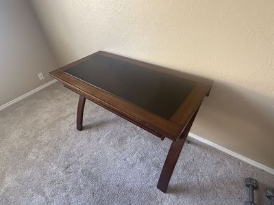 Hardwood desk with black glass top