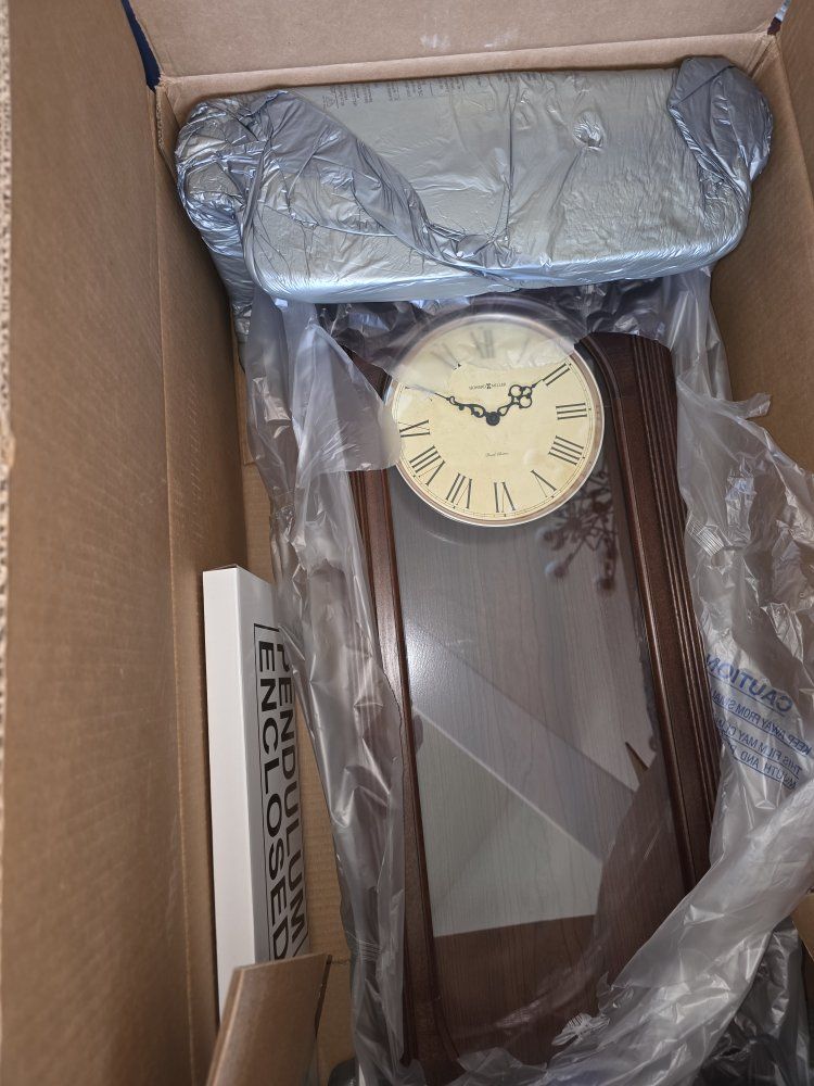 Howard Miller Wooden Wall Clock with Dual Chimes and Pendulum