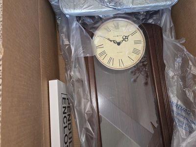 Howard Miller Wooden Wall Clock with Dual Chimes and Pendulum