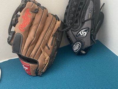 SET OF 2 SOFTBALL GLOVES 1 RIGHT 1 LEFT HANDED. 13” & 12.75 “