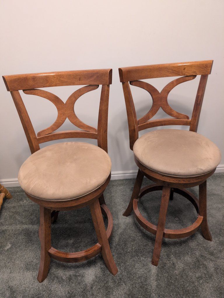 Pair of Wood Swivel Bar Stools with X-Back Design & Beige Cushioned Seats