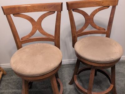 Pair of Wood Swivel Bar Stools with X-Back Design & Beige Cushioned Seats