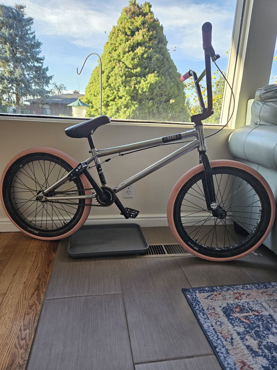 Haro Midway BMX Bike Chrome with Pink Tires and Pivotal Seat