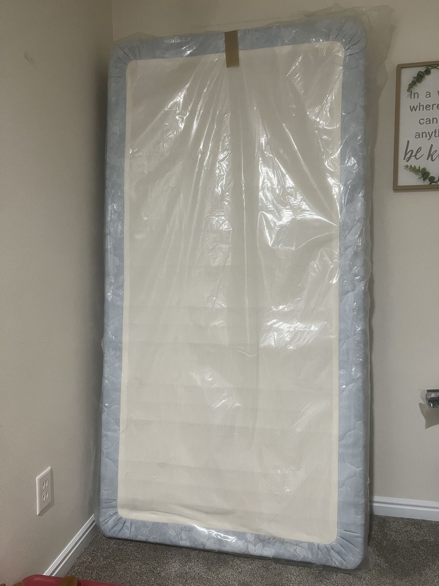 Twin box spring - never used, still in the plastic