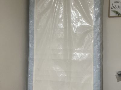 Twin box spring - never used, still in the plastic